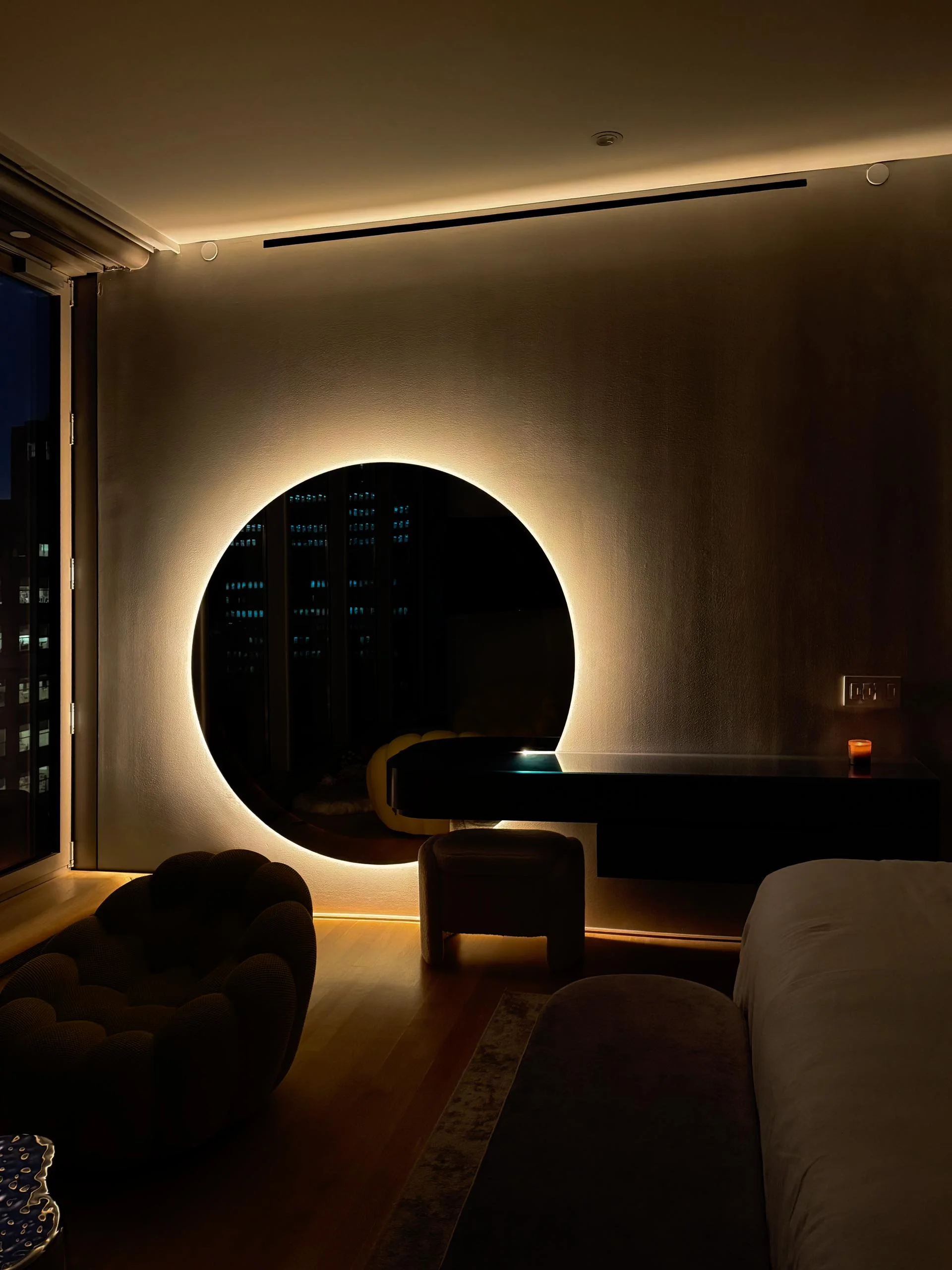 HER console at night, LED halo glowing around the six-foot mirror