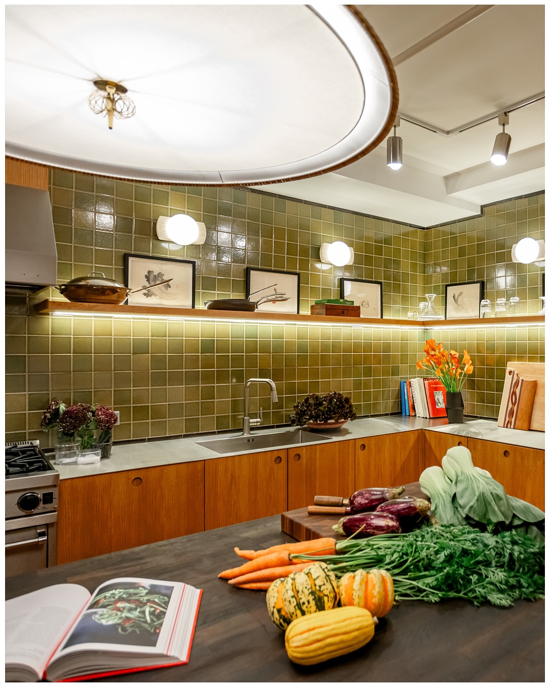 Wide view of the kitchen with a curved ceiling detail and produce on the counter