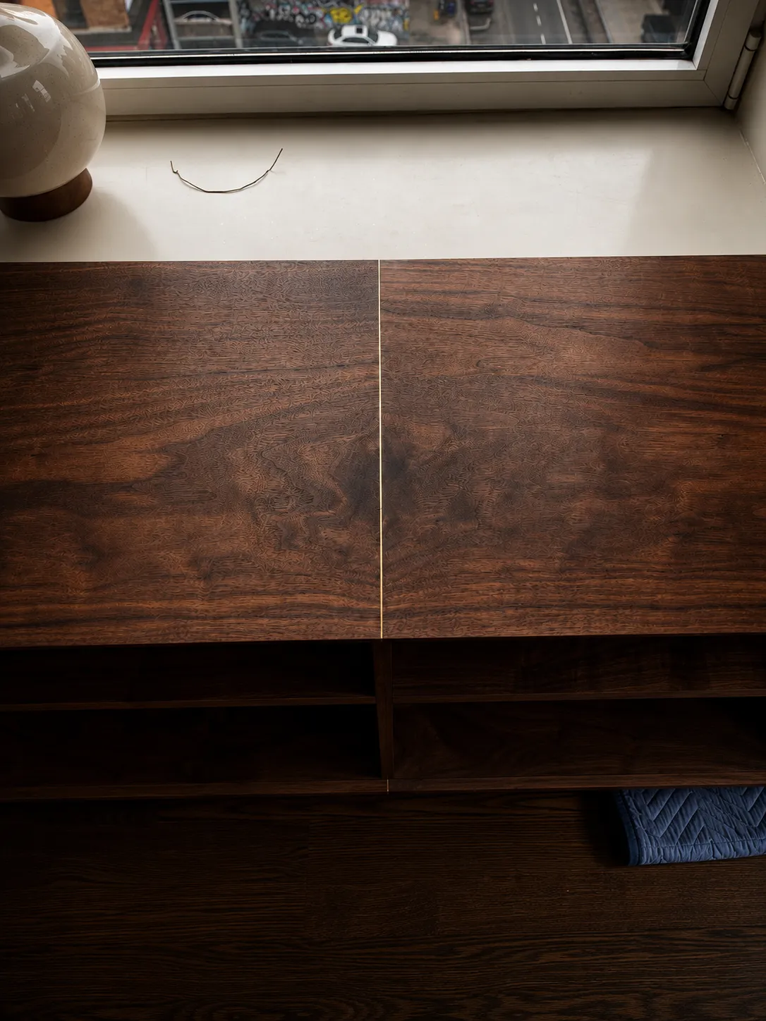 Brass inlay seam on credenza top