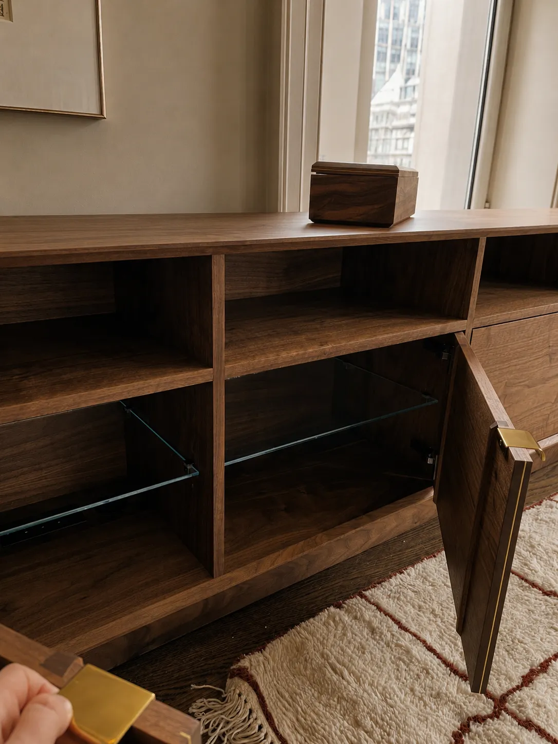 Open cabinet — glass shelf and brass hardware