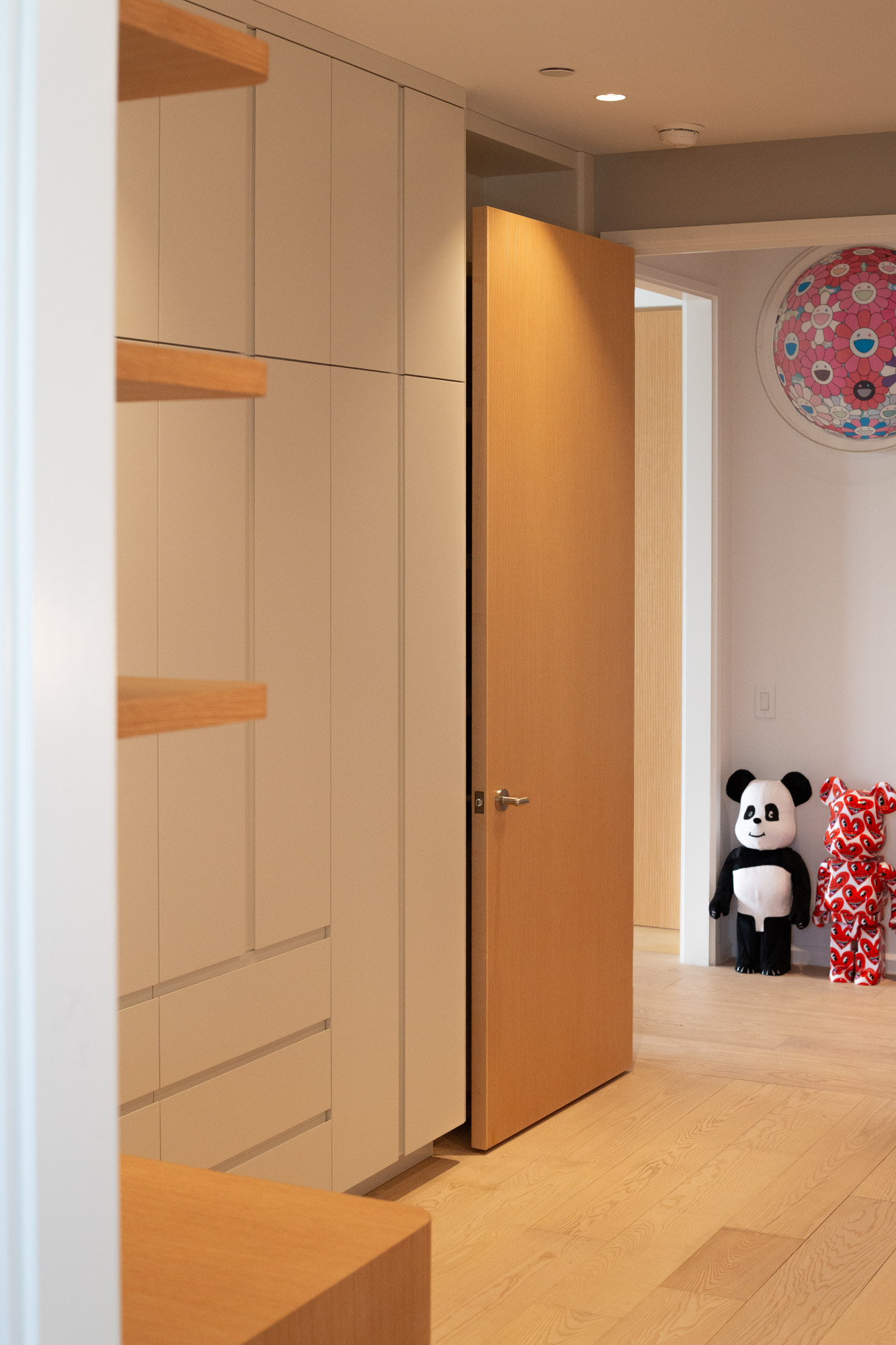 The wardrobe wall — door open, room beyond